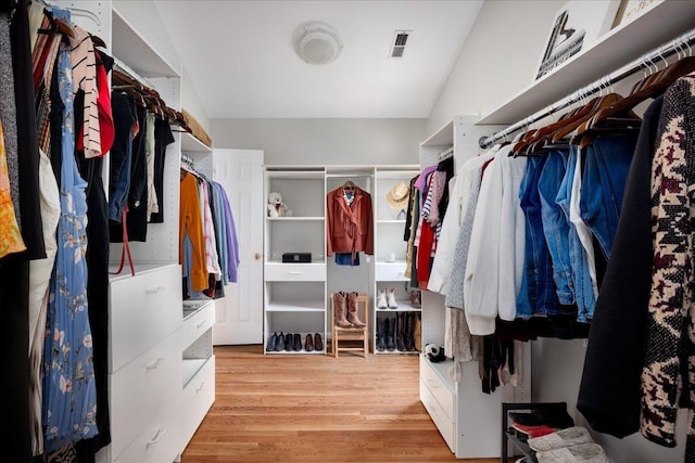 walk in closet featuring light hardwood / wood-style floors