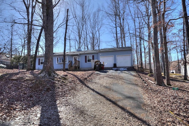 single story home with a garage