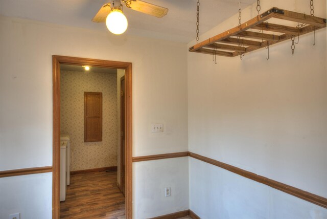 hall featuring washer / clothes dryer and dark wood-type flooring