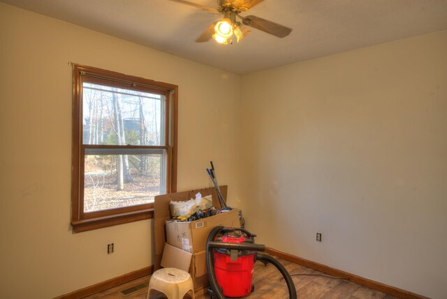 misc room featuring ceiling fan and light wood-type flooring