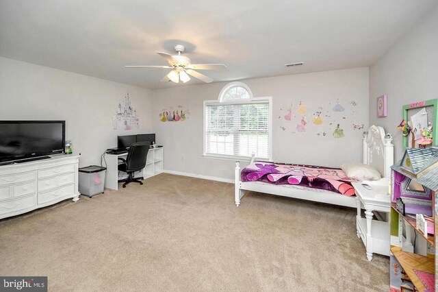 bedroom featuring baseboards, visible vents, a ceiling fan, and light colored carpet