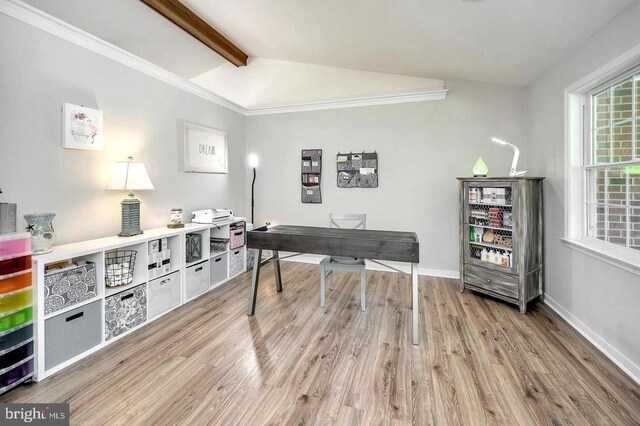 home office featuring light wood-type flooring, vaulted ceiling with beams, and baseboards