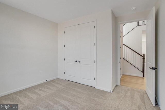 carpeted living room with crown molding and a wealth of natural light