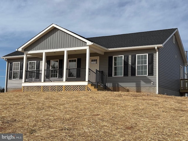 view of front of house featuring covered porch, roof with shingles, and crawl space