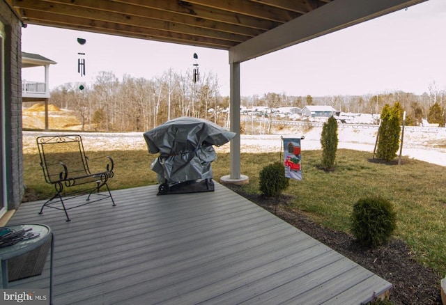 deck with central AC, a lawn, and a grill