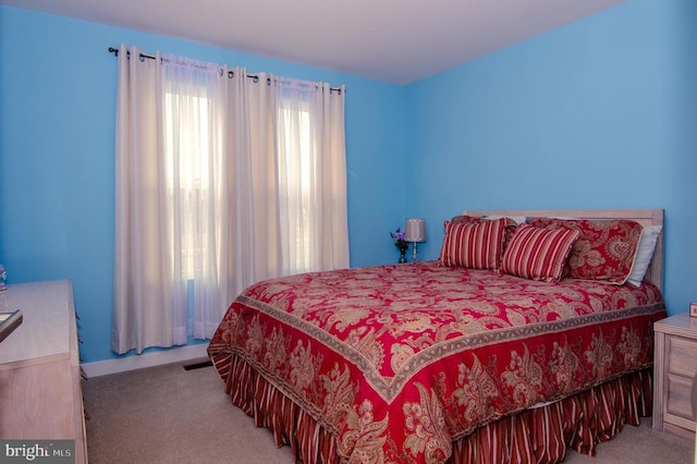 carpeted bedroom with visible vents