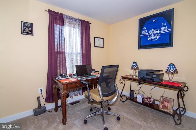 carpeted office with baseboards