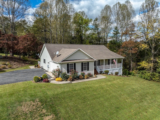 view of front of home with a porch and a front lawn