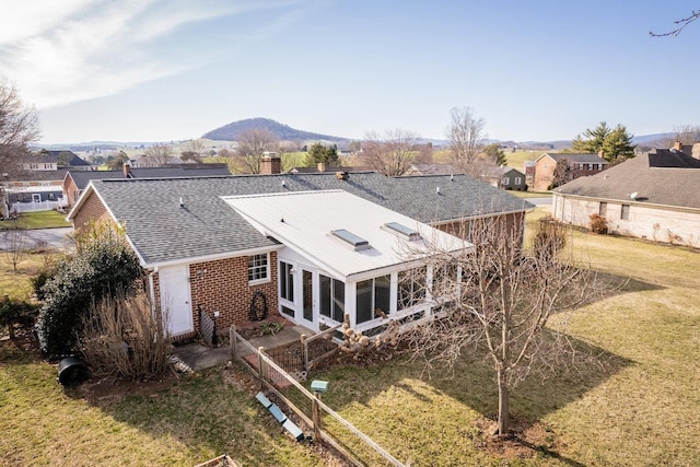 drone / aerial view featuring a mountain view