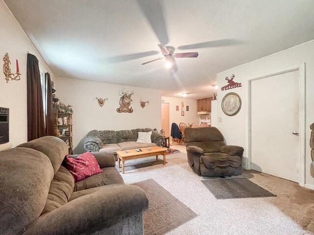 living room featuring ceiling fan and carpet floors