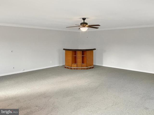 unfurnished living room with ceiling fan, crown molding, and carpet