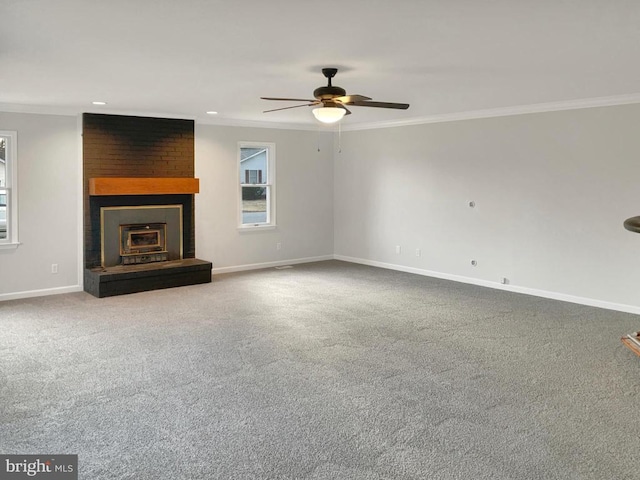 unfurnished living room with carpet floors, ornamental molding, and ceiling fan