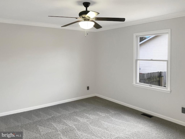 carpeted empty room with crown molding and ceiling fan