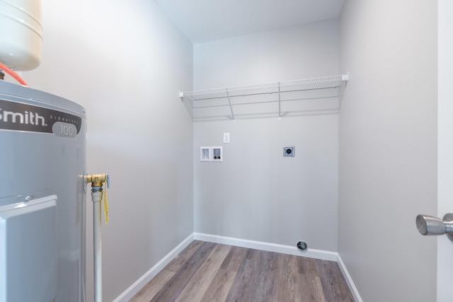 laundry area featuring washer hookup, hookup for an electric dryer, laundry area, wood finished floors, and baseboards