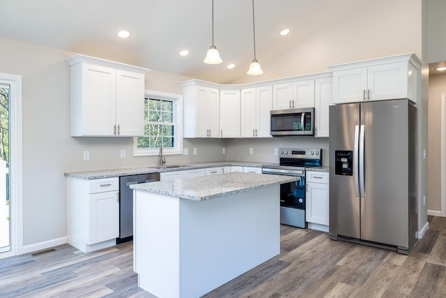 kitchen with white cabinetry, appliances with stainless steel finishes, and a sink