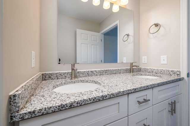 full bath with double vanity and a sink