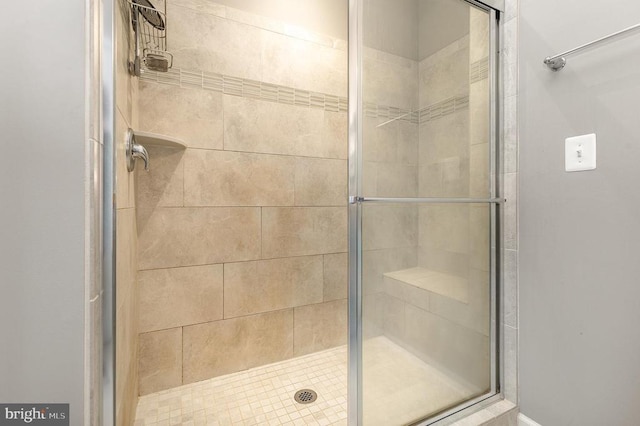 bathroom with a shower stall