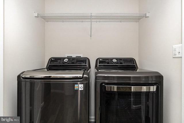 laundry area featuring washer and dryer and laundry area