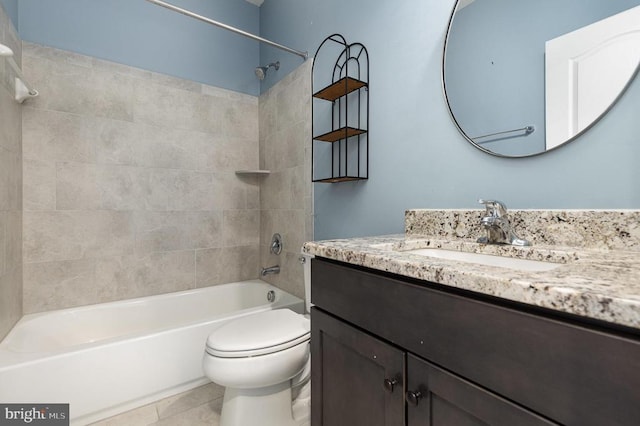 bathroom featuring shower / bath combination, toilet, vanity, and tile patterned flooring