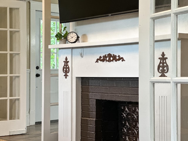 interior details with hardwood / wood-style floors and a fireplace