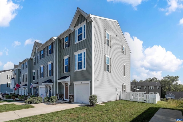 exterior space featuring a garage and a front yard