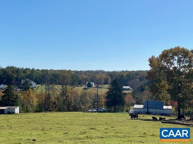 view of yard with a rural view