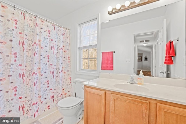 bathroom featuring toilet, a shower with curtain, and vanity