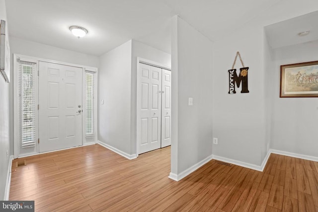 foyer entrance with light hardwood / wood-style flooring