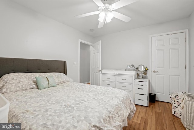 bedroom with ceiling fan and light hardwood / wood-style flooring