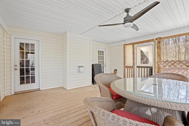 sunroom / solarium with ceiling fan