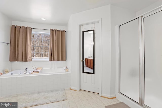 bathroom featuring separate shower and tub