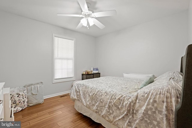 bedroom with ceiling fan and light hardwood / wood-style flooring