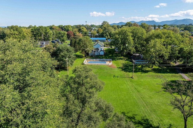 birds eye view of property with a mountain view