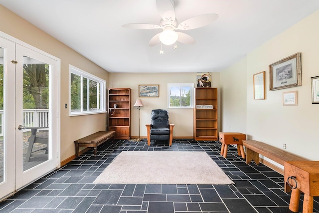 sitting room with ceiling fan and a healthy amount of sunlight