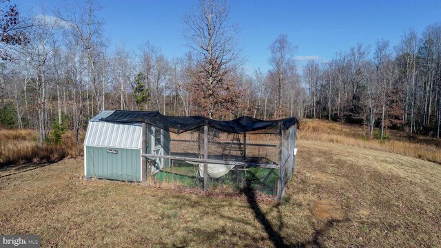 view of outbuilding with a lawn