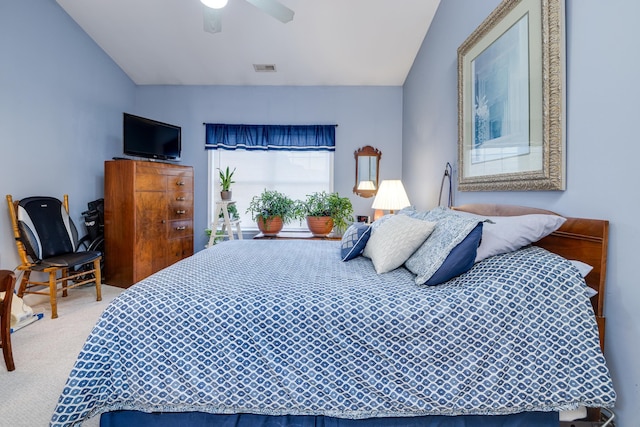 carpeted bedroom featuring vaulted ceiling and ceiling fan