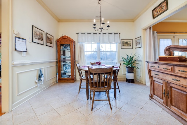 dining area with crown molding, light tile patterned floors, and a notable chandelier