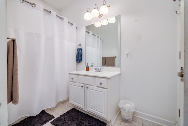 bathroom featuring tile patterned flooring and vanity