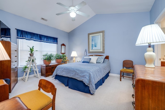 bedroom with ceiling fan, vaulted ceiling, and carpet