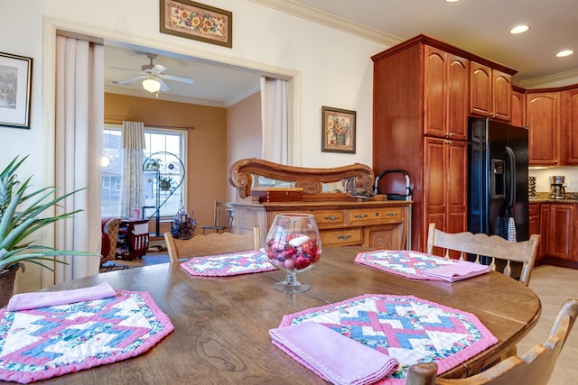 dining space featuring ornamental molding and ceiling fan