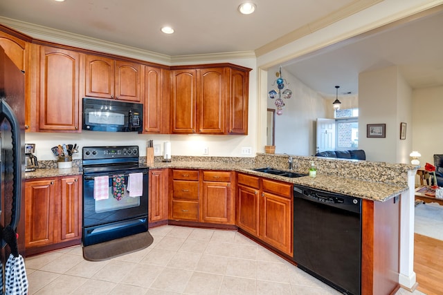 kitchen featuring sink, light tile patterned flooring, black appliances, and light stone countertops