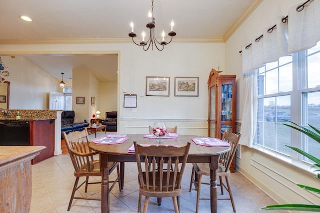 tiled dining room featuring crown molding, plenty of natural light, and a chandelier