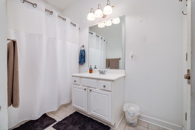 bathroom with tile patterned flooring, walk in shower, and toilet