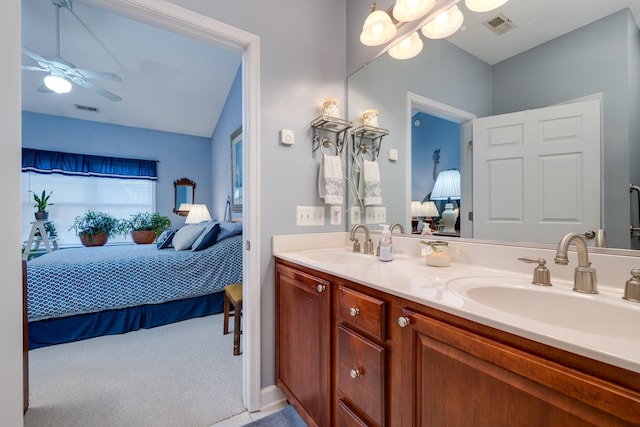 bathroom featuring vanity, lofted ceiling, and ceiling fan