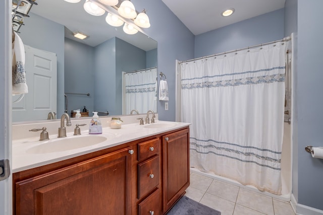 bathroom featuring tile patterned floors, a chandelier, and vanity