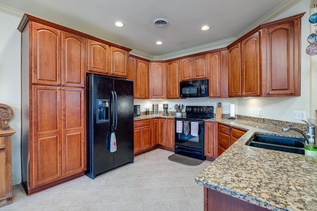 kitchen featuring light tile patterned flooring, sink, ornamental molding, black appliances, and light stone countertops