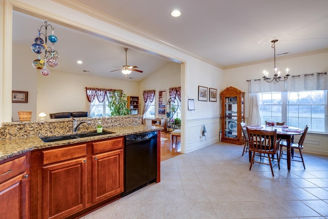 kitchen featuring light stone counters, sink, plenty of natural light, and dishwasher