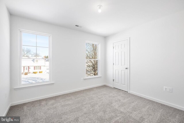 view of carpeted spare room