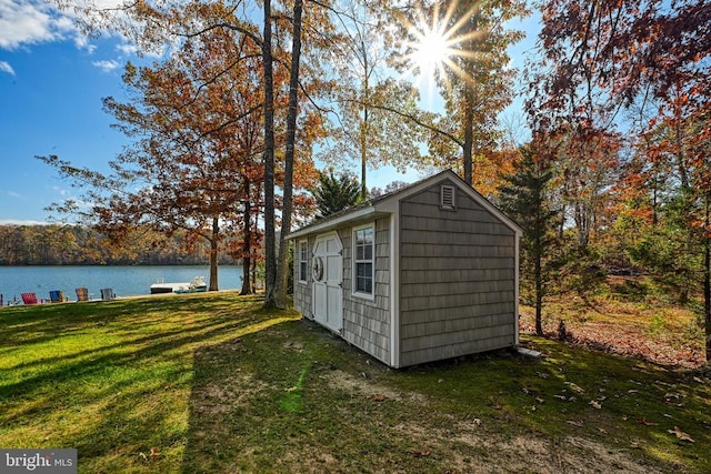 view of outbuilding featuring an outdoor structure and a water view