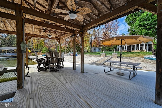 surrounding community featuring a dock, a storage unit, and an outdoor structure